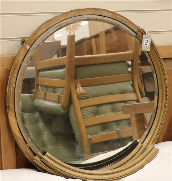 A circular gilt frame wall mirror (a.f.), W.77cm